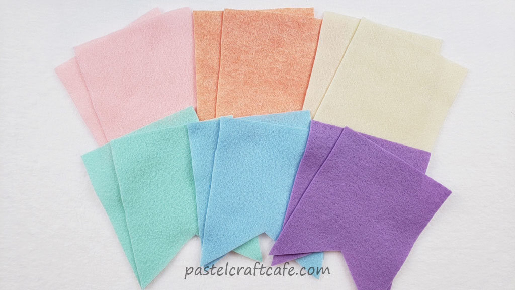 Six pairs of cut out rectangular flag shapes in pastel rainbow colors