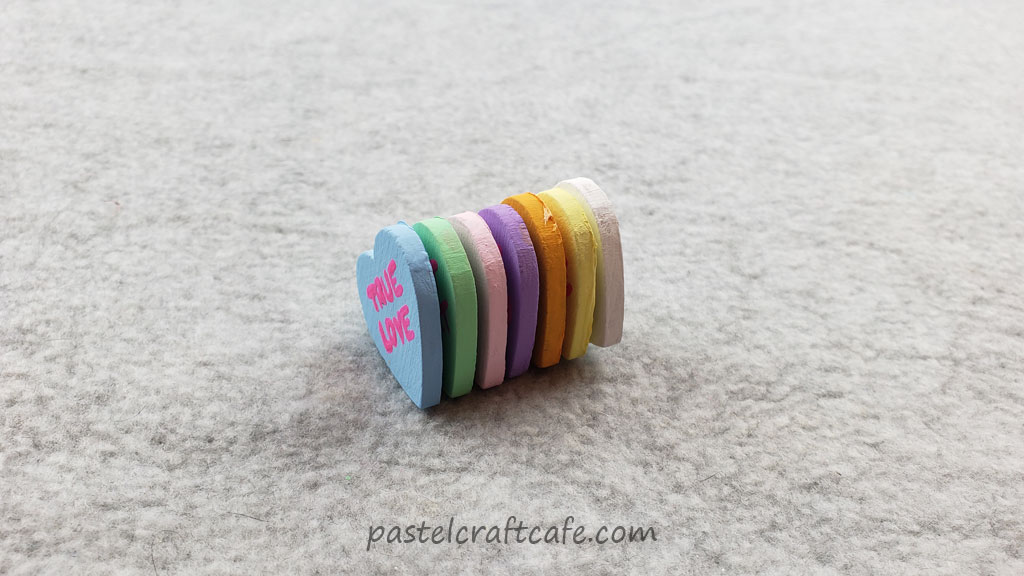 A stack of conversation heart magnets connected together