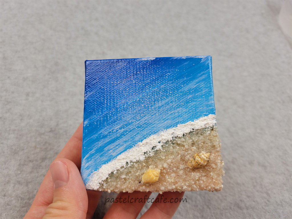 Showing the gloss on a mini mixed media beach canvas