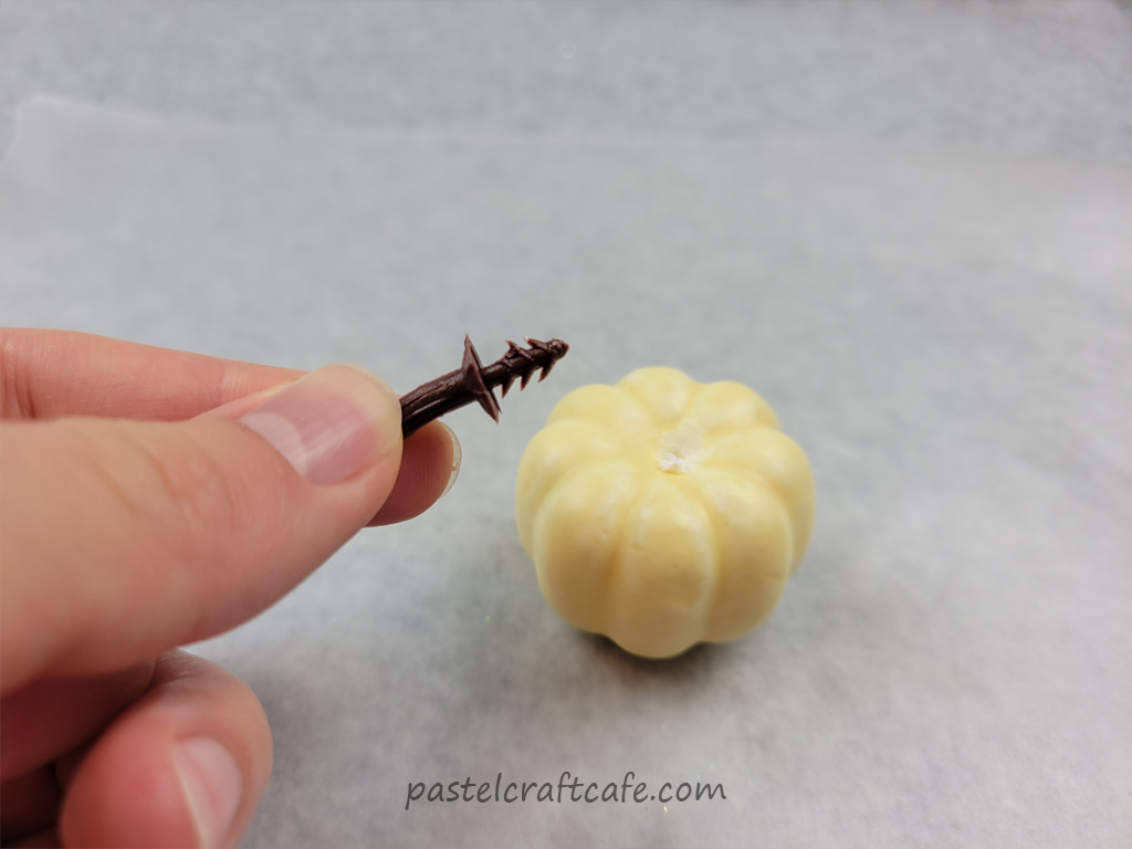 The stem pulled out of a craft pumpkin