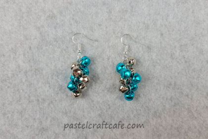 A set of blue and silver jingle bell cluster earrings