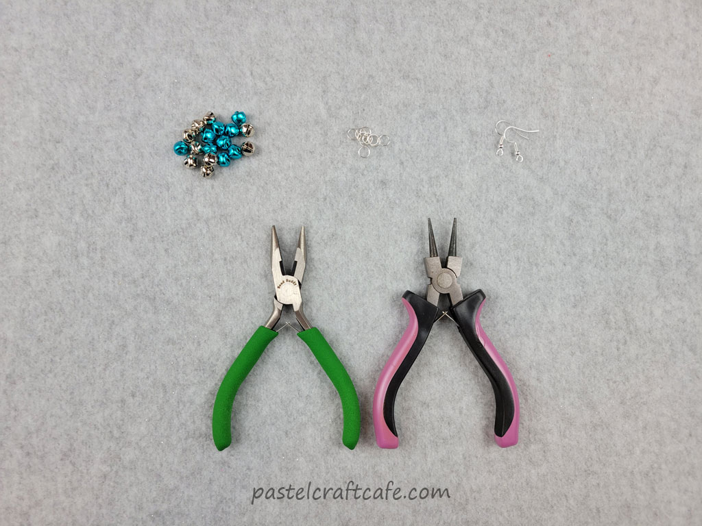 Small jingle bells, jump rings, earring hooks, and jewelry pliers