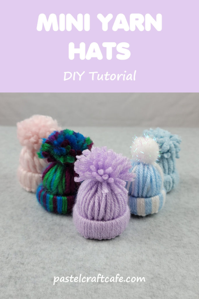 Text "Mini Yarn Hats DIY Tutorial" above multiple yarn hats arranged in a V shape