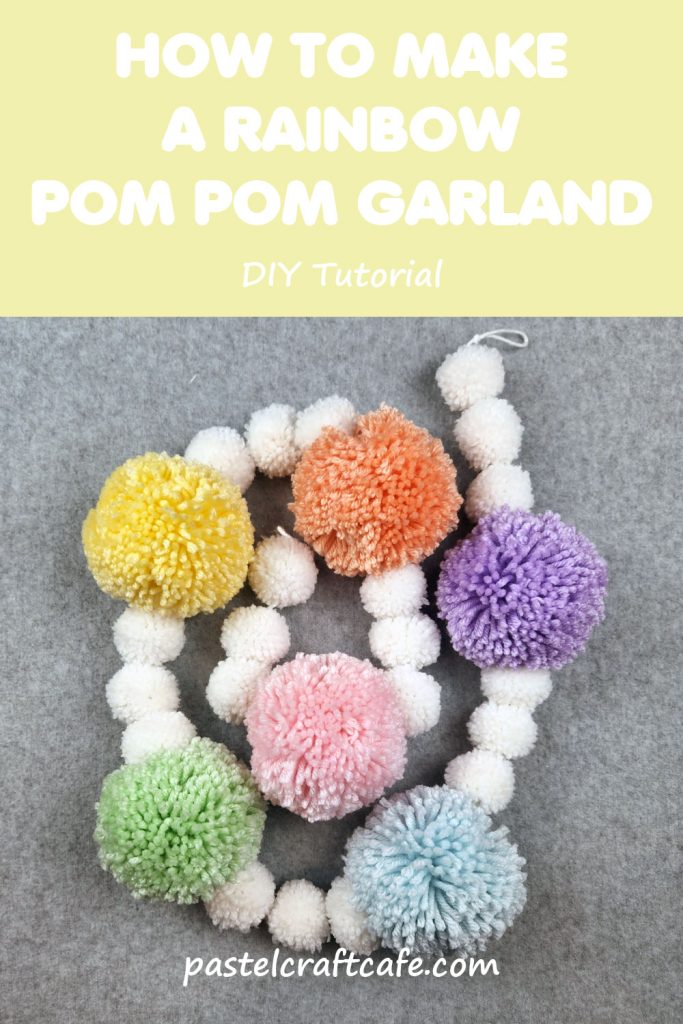 Text "How To Make A Rainbow Pom Pom Garland DIY Tutorial" above a pastel rainbow pom pom garland twisted into a spiral