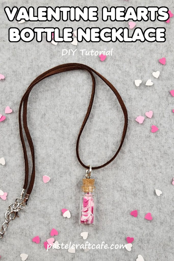 Words "Valentine Hearts Bottle Necklace DIY Tutorial" above a necklace with a bottle charm filled with paper hearts and more paper hearts scattered around